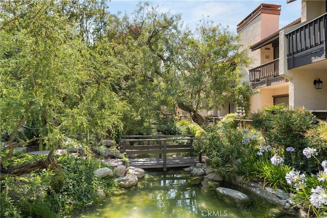 21730 Marylee St Unit 29, Woodland Hills, CA 91367 - surrounding community with a garden pond