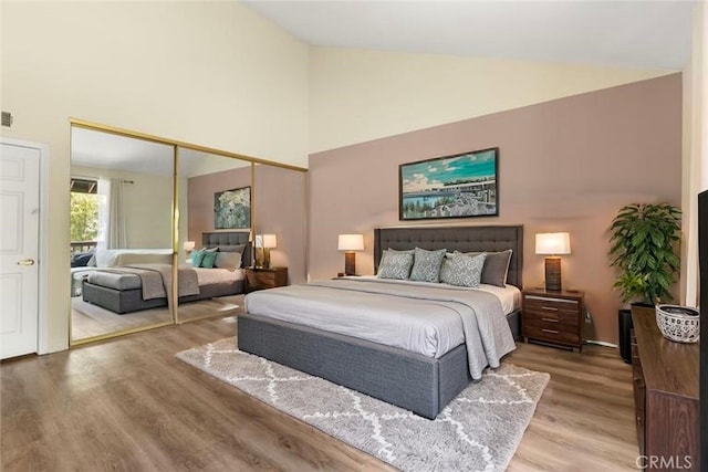 21730 Marylee St Unit 29, Woodland Hills, CA 91367 - bedroom featuring wood finished floors, high vaulted ceiling, and a closet