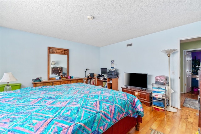 19722 Tajauta Ave, Carson, CA 90746 - bedroom featuring wood finished floors and a textured ceiling