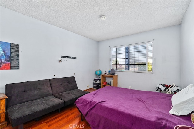 19722 Tajauta Ave, Carson, CA 90746 - bedroom with wood finished floors and a textured ceiling