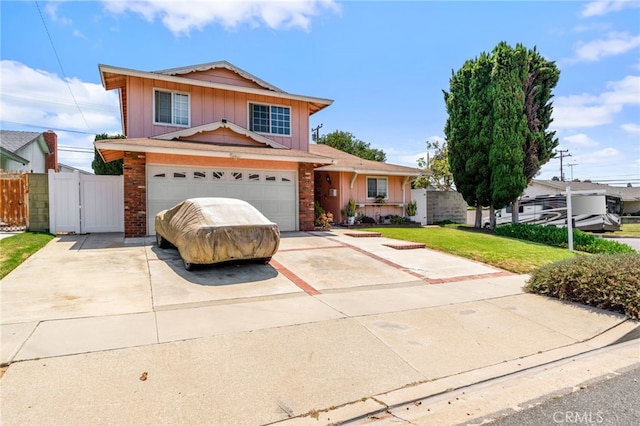 19722 Tajauta Ave, Carson, CA 90746 - traditional home with brick siding, concrete driveway, a gate, and board and batten siding