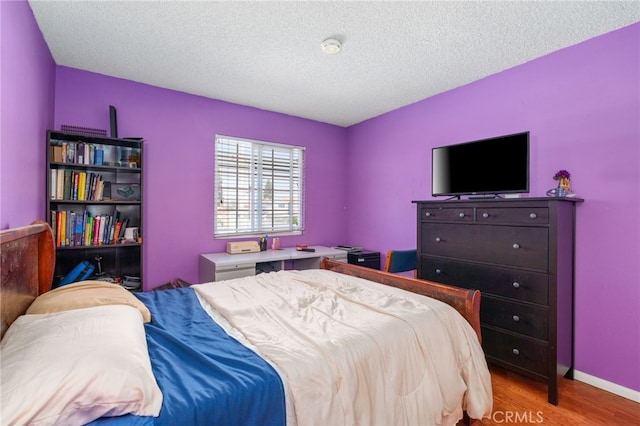 19722 Tajauta Ave, Carson, CA 90746 - bedroom featuring wood finished floors and a textured ceiling