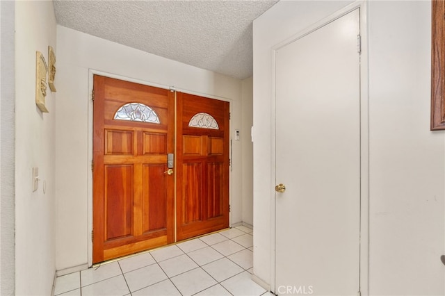 19722 Tajauta Ave, Carson, CA 90746 - entryway with light tile patterned floors and a textured ceiling