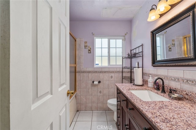 19722 Tajauta Ave, Carson, CA 90746 - full bathroom with tile walls, tile patterned floors, vanity, wainscoting, and a shower