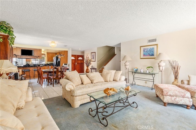 19722 Tajauta Ave, Carson, CA 90746 - carpeted living area featuring stairway and a textured ceiling