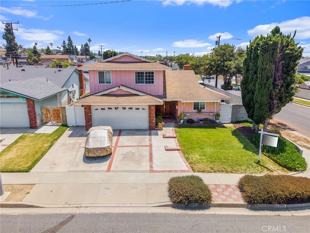 19722 Tajauta Ave, Carson, CA 90746 - traditional-style home with concrete driveway, a gate, brick siding, board and batten siding, and roof with shingles