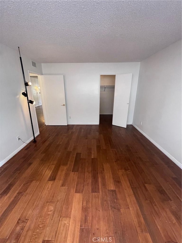5328 Newcastle Ave Unit 26, Encino, CA 91316 - empty room featuring hardwood / wood-style flooring and a textured ceiling