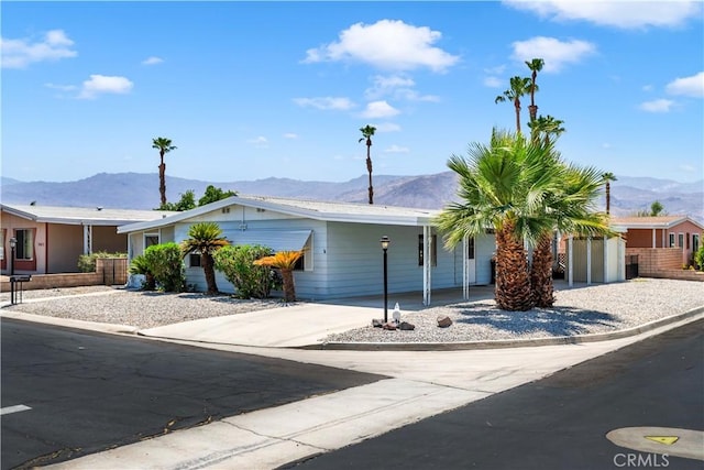 74084 Mercury Cir W, Palm Desert, CA 92260 - ranch-style home featuring a mountain view and concrete driveway
