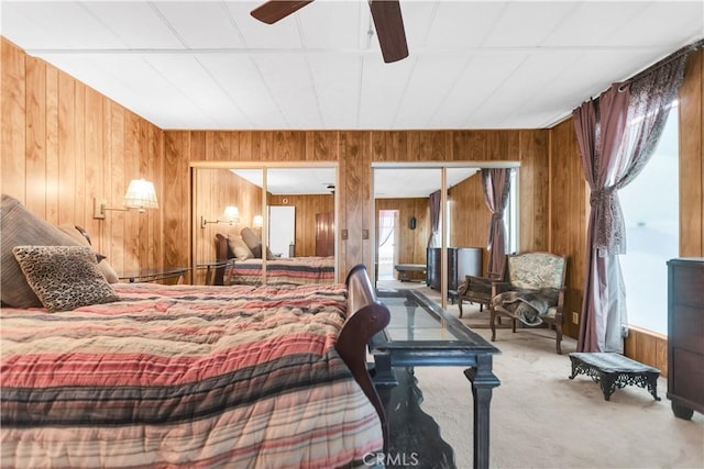 74084 Mercury Cir W, Palm Desert, CA 92260 - carpeted bedroom featuring wooden walls and a ceiling fan