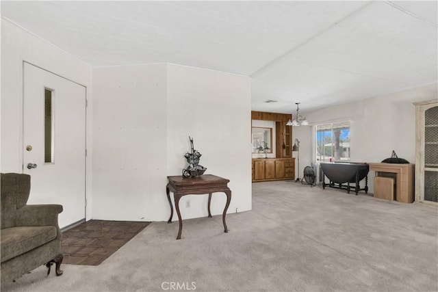 74084 Mercury Cir W, Palm Desert, CA 92260 - living area featuring carpet floors and a chandelier