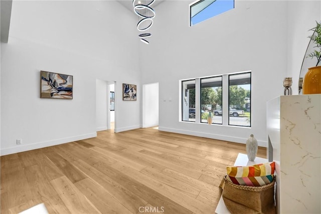 1027 N Lamer St, Burbank, CA 91506 - living area featuring healthy amount of natural light, light wood finished floors, and a high ceiling