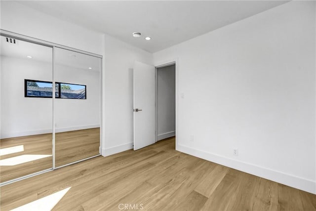 1027 N Lamer St, Burbank, CA 91506 - unfurnished bedroom with wood finished floors, a closet, and recessed lighting