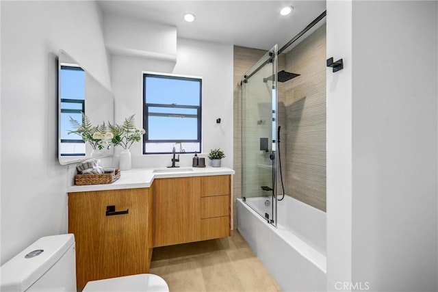 1027 N Lamer St, Burbank, CA 91506 - bathroom featuring vanity, bath / shower combo with glass door, recessed lighting, and wood finished floors