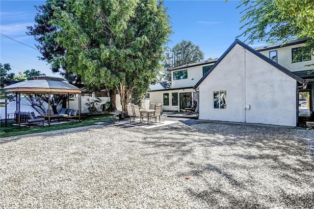 1027 N Lamer St, Burbank, CA 91506 - rear view of house featuring a gazebo, a patio area, and stucco siding