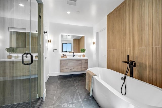 1027 N Lamer St, Burbank, CA 91506 - full bathroom with double vanity, a soaking tub, a stall shower, and tile patterned floors