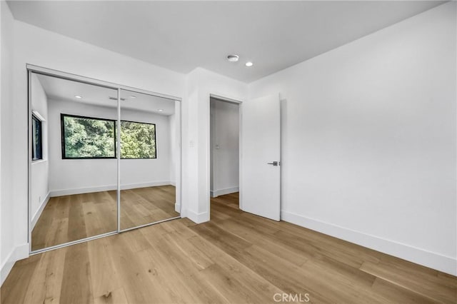 1027 N Lamer St, Burbank, CA 91506 - unfurnished bedroom featuring recessed lighting, light wood-style floors, and a closet