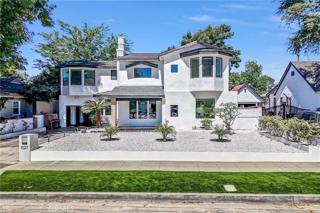 1027 N Lamer St, Burbank, CA 91506 - modern home with stucco siding and a chimney
