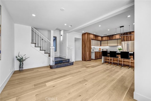 1027 N Lamer St, Burbank, CA 91506 - living area with light wood finished floors, stairs, and recessed lighting