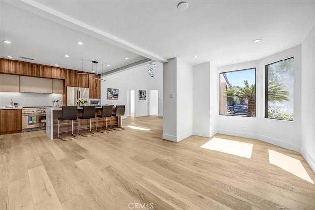 1027 N Lamer St, Burbank, CA 91506 - kitchen with stainless steel appliances, modern cabinets, brown cabinetry, light wood finished floors, and recessed lighting