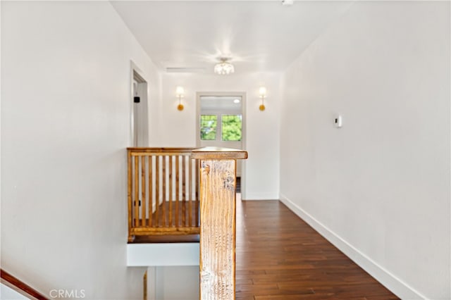 229 S Kingsley Dr, Los Angeles, CA 90004 - hallway featuring baseboards and dark wood-style flooring