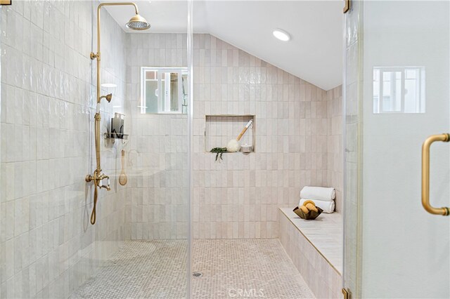 229 S Kingsley Dr, Los Angeles, CA 90004 - bathroom with tiled shower, vaulted ceiling, and plenty of natural light