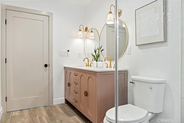 229 S Kingsley Dr, Los Angeles, CA 90004 - bathroom with double vanity and wood finished floors