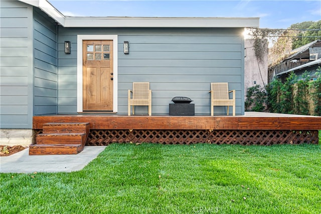 229 S Kingsley Dr, Los Angeles, CA 90004 - view of exterior entry featuring a lawn