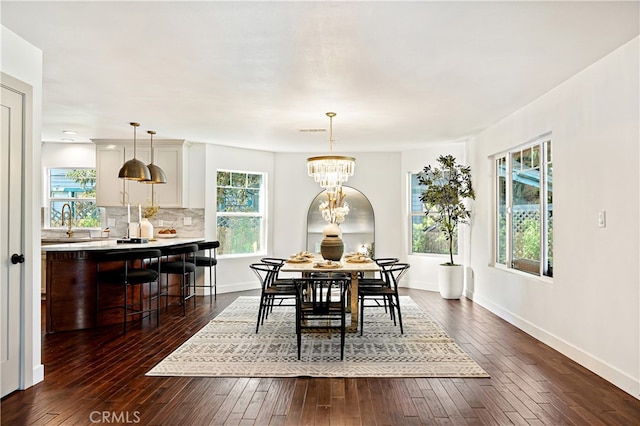 229 S Kingsley Dr, Los Angeles, CA 90004 - dining space with dark wood-type flooring and a chandelier