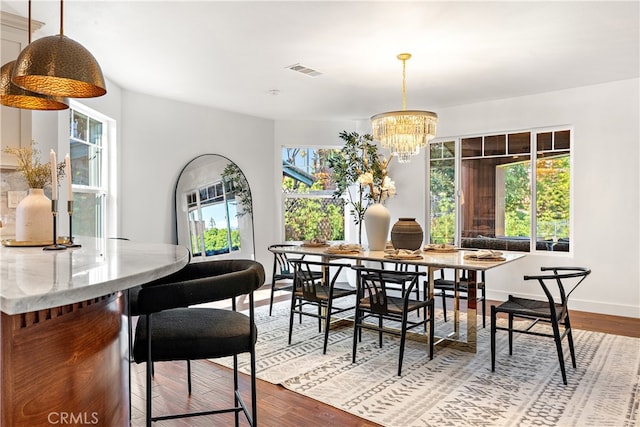 229 S Kingsley Dr, Los Angeles, CA 90004 - dining room with wood finished floors and a chandelier