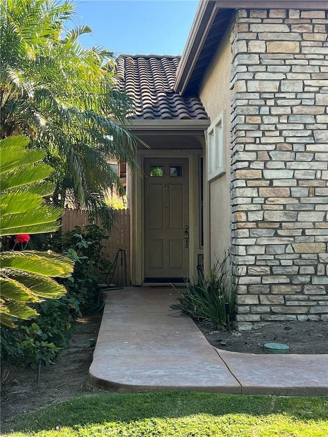 4630 Via Dulce, Camarillo, CA 93012 - doorway to property with stucco siding and a tiled roof