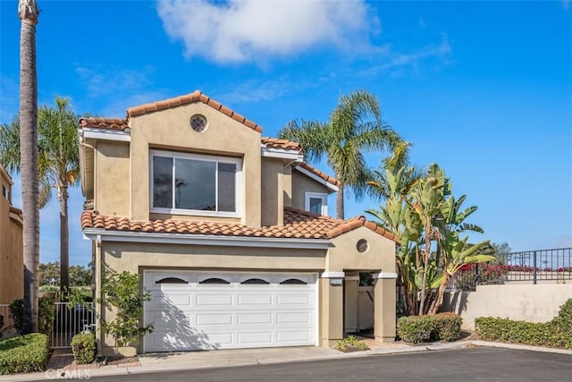 33551 Sandcastle Ct, Dana Point, CA 92629 - mediterranean / spanish-style house with stucco siding, a tile roof, an attached garage, and concrete driveway