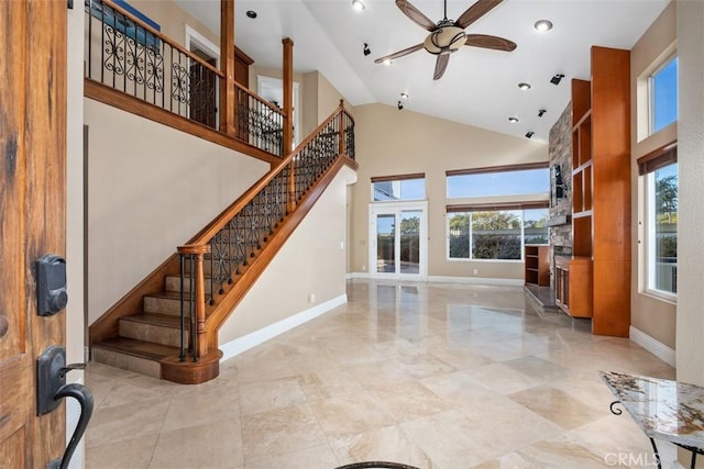 33551 Sandcastle Ct, Dana Point, CA 92629 - entryway with plenty of natural light, a ceiling fan, high vaulted ceiling, stairway, and a fireplace