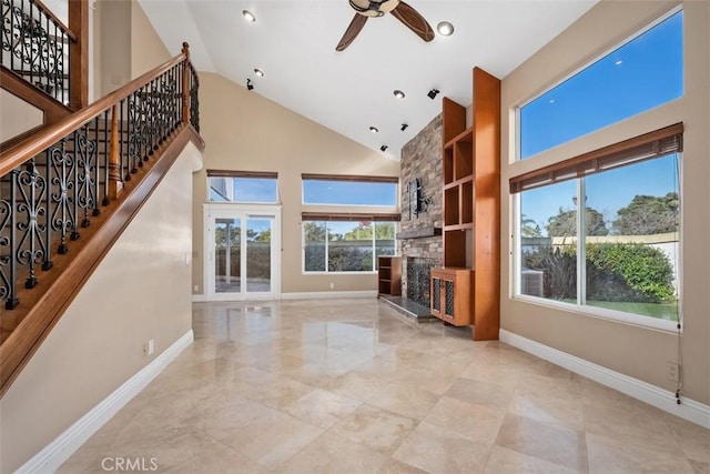 33551 Sandcastle Ct, Dana Point, CA 92629 - unfurnished living room with a ceiling fan, high vaulted ceiling, a fireplace, and stairway