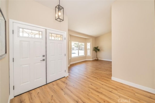 11617 Low Chaparral Dr, Victorville, CA 92392 - entrance foyer with vaulted ceiling and light wood-style flooring