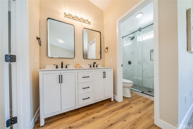 11617 Low Chaparral Dr, Victorville, CA 92392 - bathroom featuring a marble finish shower, wood finished floors, and double vanity
