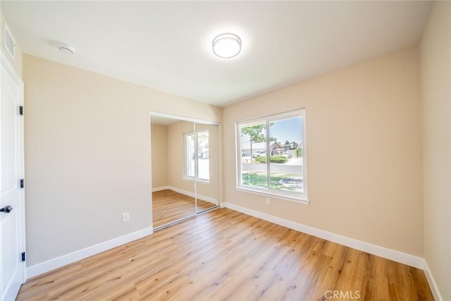 11617 Low Chaparral Dr, Victorville, CA 92392 - empty room with light wood-style flooring and a smoke detector