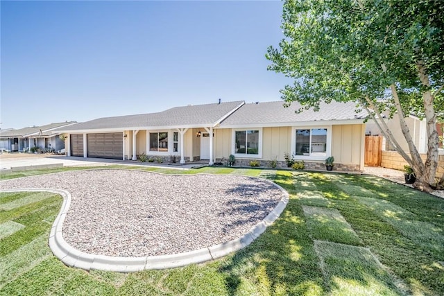 11617 Low Chaparral Dr, Victorville, CA 92392 - ranch-style home featuring a garage, board and batten siding, and concrete driveway