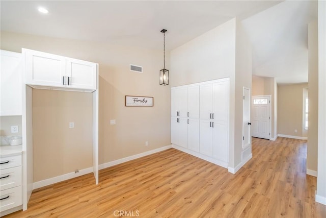 11617 Low Chaparral Dr, Victorville, CA 92392 - unfurnished dining area with vaulted ceiling and light wood finished floors