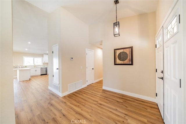 11617 Low Chaparral Dr, Victorville, CA 92392 - entrance foyer featuring a towering ceiling and light wood-style floors