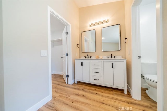11617 Low Chaparral Dr, Victorville, CA 92392 - full bathroom featuring double vanity and wood finished floors