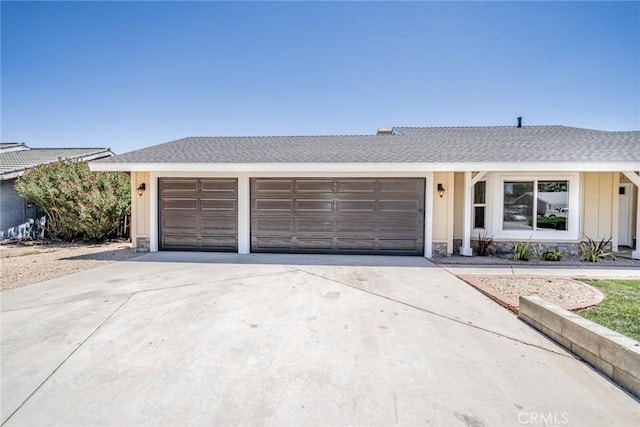 11617 Low Chaparral Dr, Victorville, CA 92392 - single story home featuring concrete driveway, an attached garage, board and batten siding, stone siding, and roof with shingles