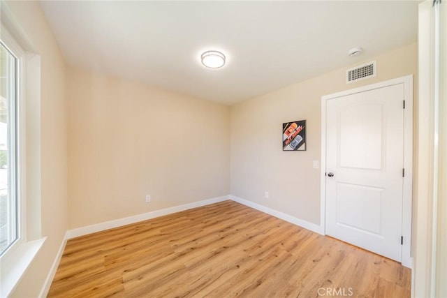 11617 Low Chaparral Dr, Victorville, CA 92392 - spare room featuring light wood-style flooring and a smoke detector