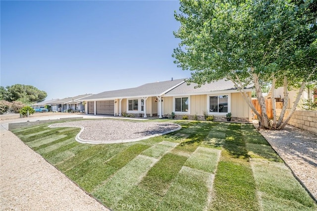 11617 Low Chaparral Dr, Victorville, CA 92392 - view of front of property with a garage, concrete driveway, and board and batten siding