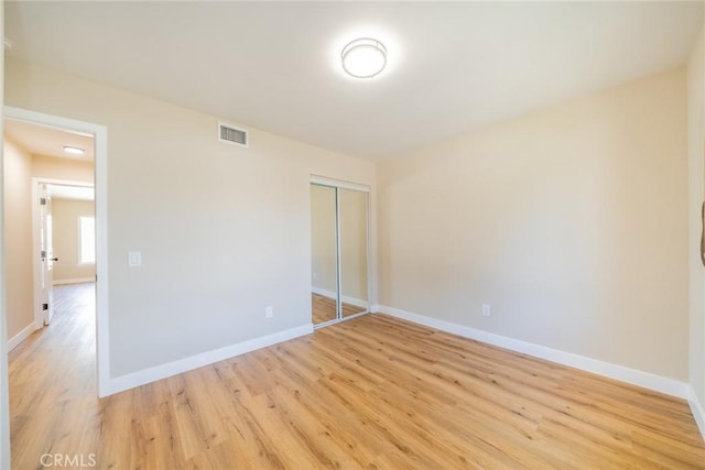 11617 Low Chaparral Dr, Victorville, CA 92392 - unfurnished bedroom featuring light wood-style floors and a closet