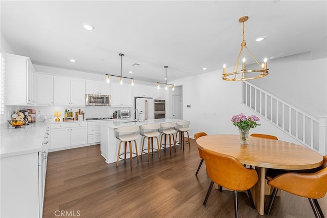 835 Orangedale Ave, Redlands, CA 92374 - dining space featuring stairway, a chandelier, recessed lighting, and dark wood-style flooring