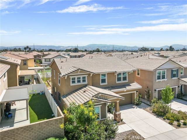 835 Orangedale Ave, Redlands, CA 92374 - view of front of home with a residential view, stucco siding, an attached garage, concrete driveway, and a mountain view