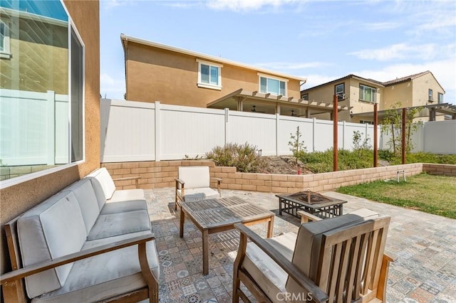835 Orangedale Ave, Redlands, CA 92374 - fenced backyard with a patio and an outdoor living space with a fire pit