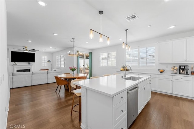 835 Orangedale Ave, Redlands, CA 92374 - kitchen with dishwasher, a ceiling fan, dark wood finished floors, light countertops, and recessed lighting