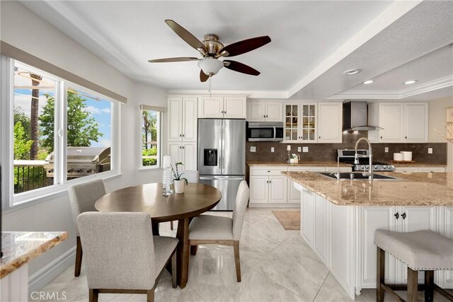 5999 Cedar Mountain Dr, Rancho Cucamonga, CA 91737 - kitchen featuring appliances with stainless steel finishes, wall chimney range hood, backsplash, a ceiling fan, and recessed lighting