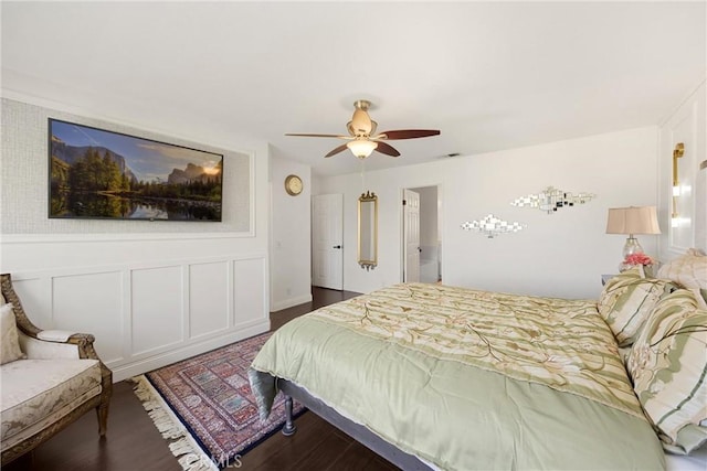 5999 Cedar Mountain Dr, Rancho Cucamonga, CA 91737 - bedroom featuring wood finished floors, a decorative wall, ceiling fan, and a wainscoted wall